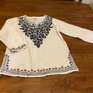 100% cotton white shirt with black embroidery. Size Med